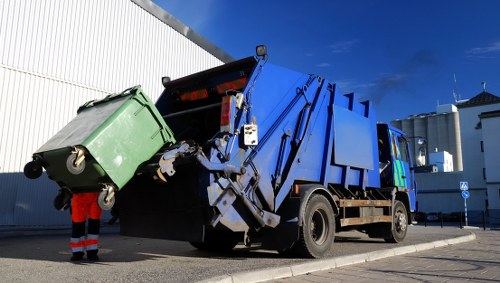 Exterior view of waste collection vehicles operating in Shepherds Bush